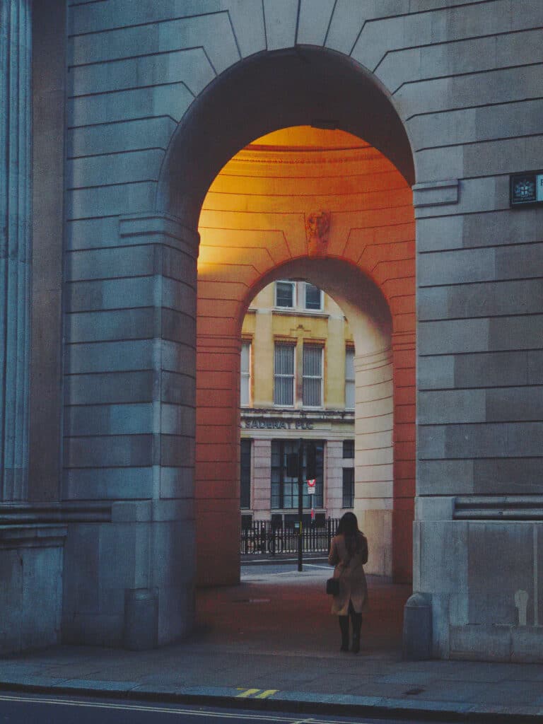 Photo of a lady walking into a light shot on iPhone